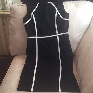 Black sheath dress with cream piping